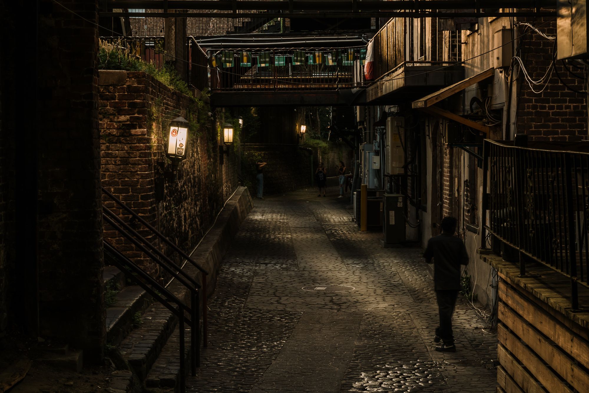 Savannah's cobblestone River Street with historic cotton warehouses at dusk